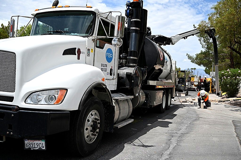 FBR vactor truck and crew at a curbside deployment.